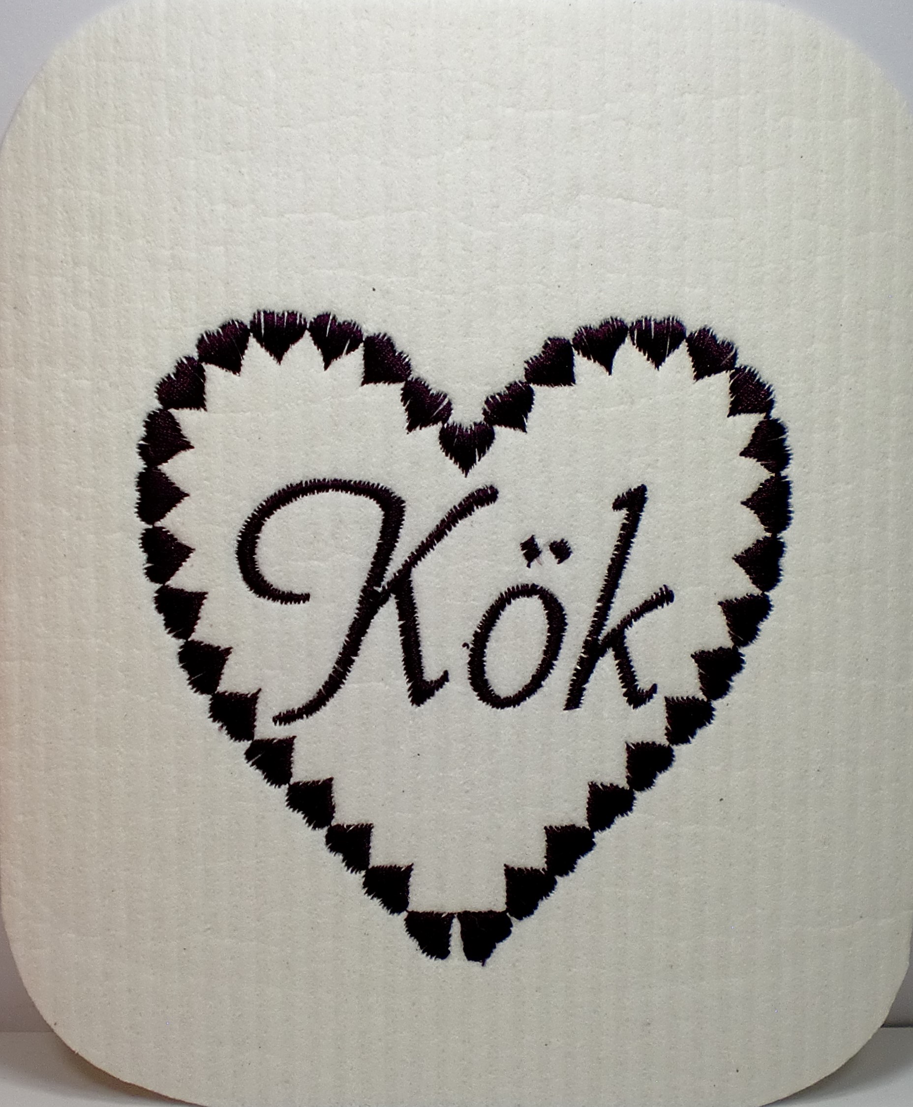 Disktrasa med maskinbroderad text